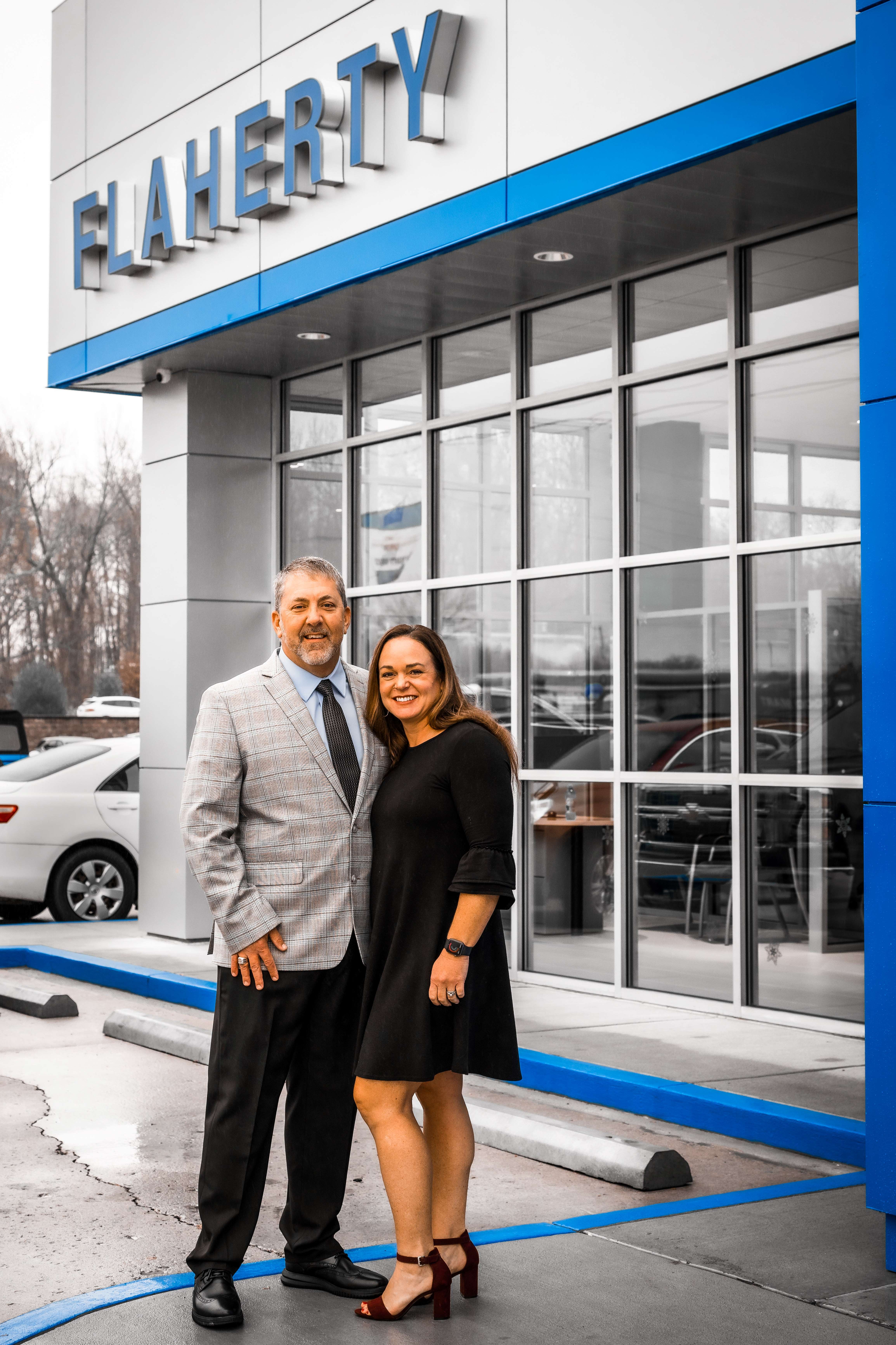 Travis and Rachel Flaherty in front of the Flaherty Chevrolet Building